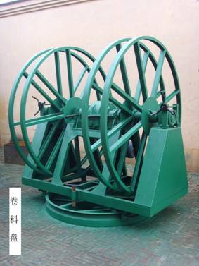 Green decoiler (steel coil reel) feeding a tube mill