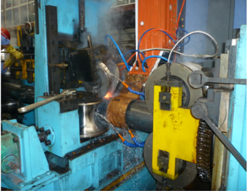 Steel pipe roll forming machine: high frequency welding section at the welding point