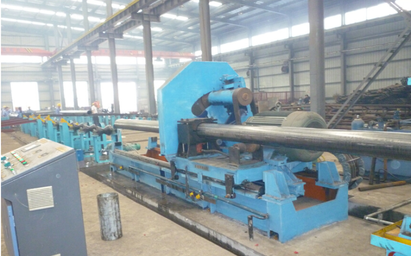 Steel pipe processing tool: pipe handling unit with control panel in the workshop