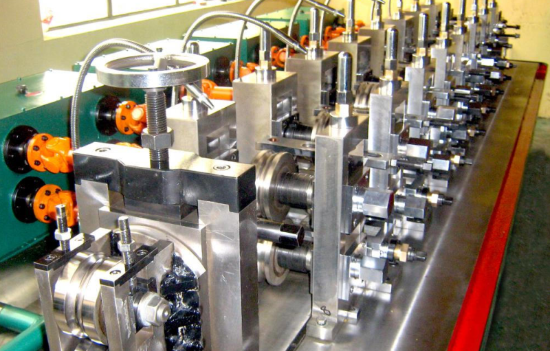 Steel pipe processing line: forming rolls and guide units close-up
