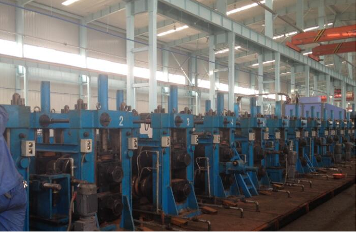 Roller coil tube making and welding machine: line stands in the workshop