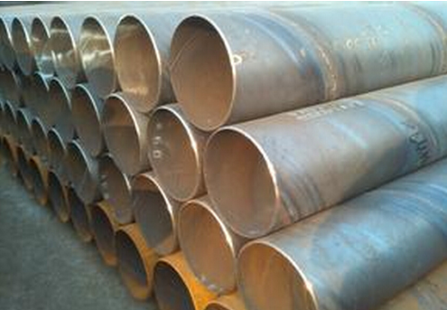 Spiral welded steel pipes stacked at the factory