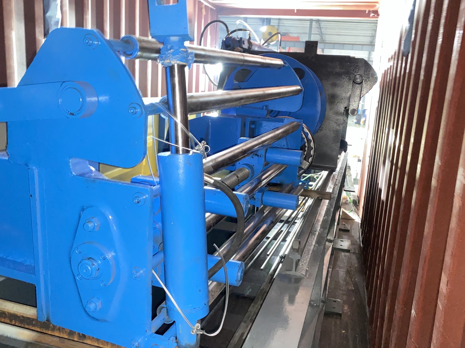 Forming stands and rolls braced inside a shipping container before dispatch
