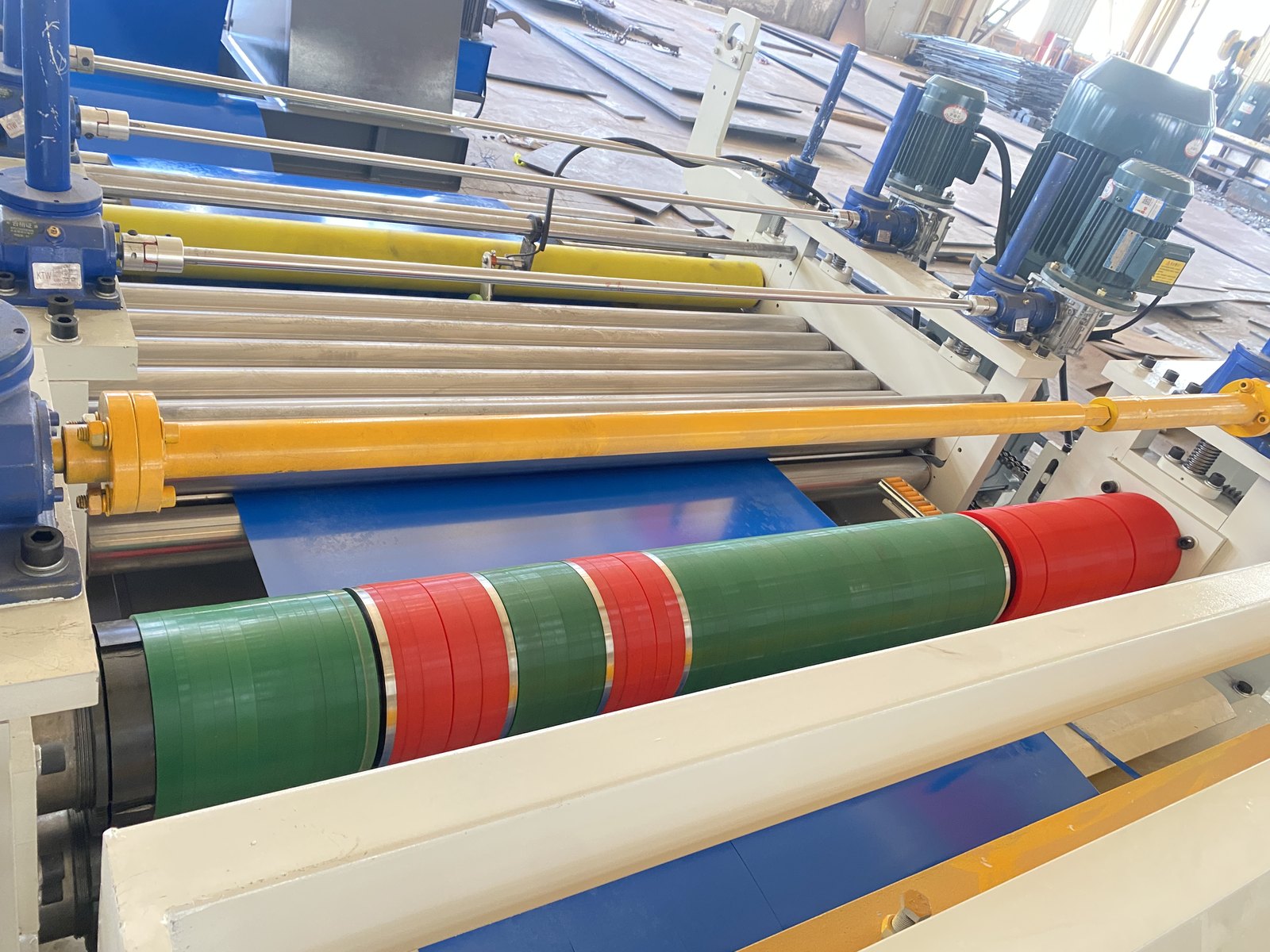 Slitting line rolls and spacer assembly with strip threaded